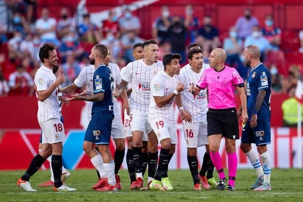 Players of Sevilla FC argue with Referee Gonzalez Fuertes during the La Liga Santader match between Sevilla FC and RCD Espanyol at Estadio Ramon...