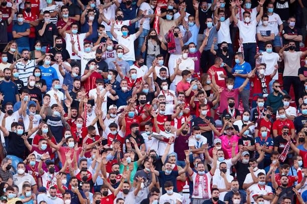 Fans of Sevilla FC cheer during the La Liga Santader match between Sevilla FC and RCD Espanyol at Estadio Ramon Sanchez Pizjuan on September 25 in...