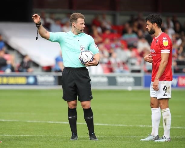 Referee Anthony Backhouse makes a point to Jason Lowe of Salford City in action during the Sky Bet League Two match between Salford City and...