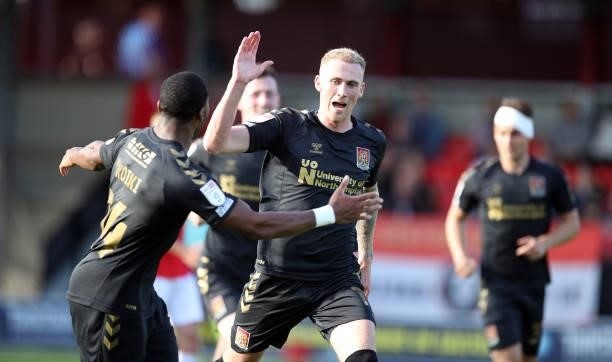 Mitch Pinnock of Northampton Town celebrates after scoring his sides second goal during the Sky Bet League Two match between Salford City and...