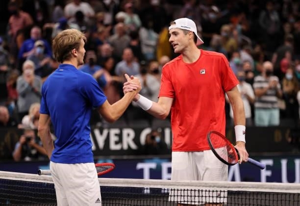 John Isner of Team World rand Alexander Zverev of Team Europe shake hands after the sixth match during Day 2 of the 2021 Laver Cup at TD Garden on...