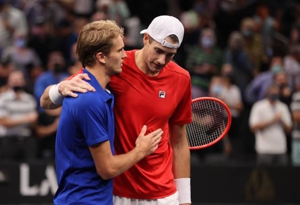 John Isner of Team World rand Alexander Zverev of Team Europe shake hands after the sixth match during Day 2 of the 2021 Laver Cup at TD Garden on...