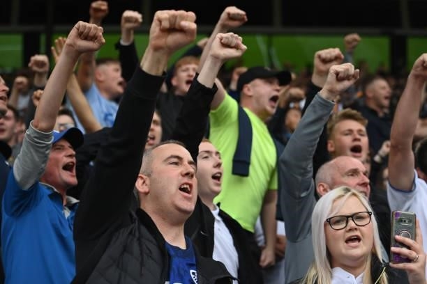 Leeds fans sing during the Premier League match between Leeds United and West Ham United at Elland Road on September 25, 2021 in Leeds, England.