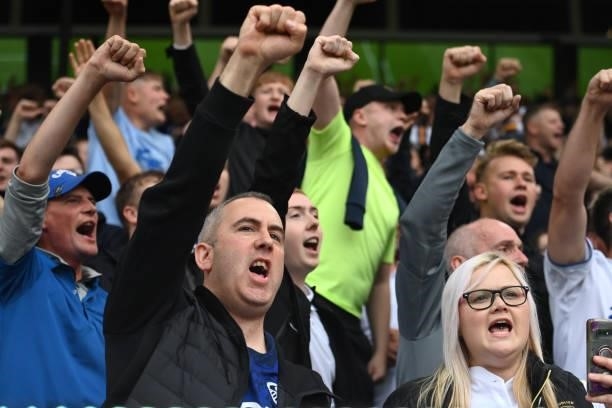 Leeds fans sing during the Premier League match between Leeds United and West Ham United at Elland Road on September 25, 2021 in Leeds, England.