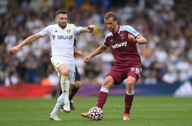West Ham player Tomas Soucek beats Stuart Dallas of Leeds to the ball during the Premier League match between Leeds United and West Ham United at...