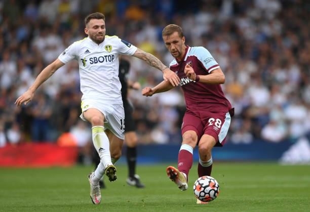 West Ham player Tomas Soucek beats Stuart Dallas of Leeds to the ball during the Premier League match between Leeds United and West Ham United at...