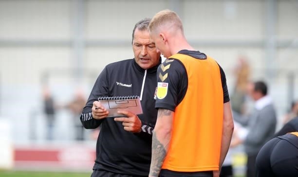 Northampton Town assistant manager Colin Calderwood gives instructions to Mitch Pinnock prior to coming on as a substitute during the Sky Bet League...
