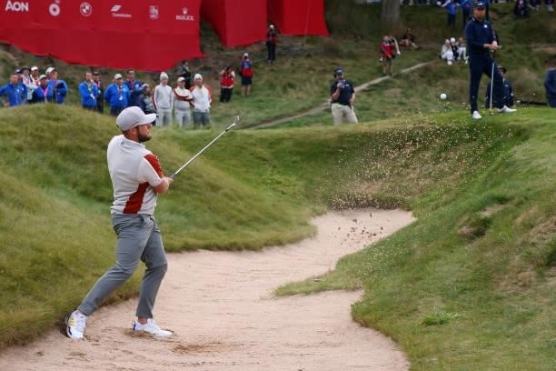 Tyrrell Hatton of England and team Europe plays a shot from a bunker on the 18th hole during Saturday Afternoon Fourball Matches of the 43rd Ryder...