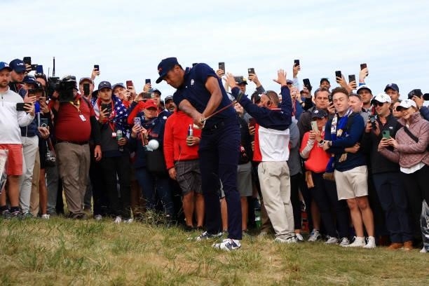 Tony Finau of team United States plays his second shot on the 18th hole during Saturday Afternoon Fourball Matches of the 43rd Ryder Cup at Whistling...