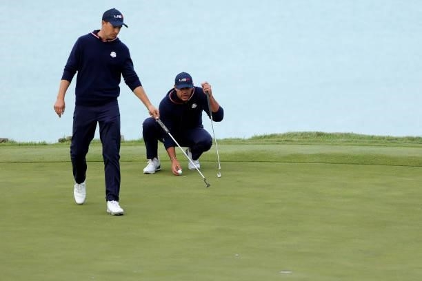 Jordan Spieth of team United States and Brooks Koepka of team United States line up a putt during Saturday Afternoon Fourball Matches of the 43rd...