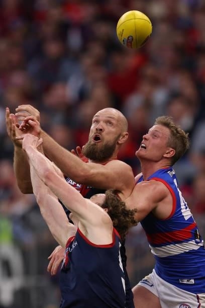 Ben Brown and Max Gawn of the Demons contest for mark against Alex Keath of the Bulldogs during the 2021 AFL Grand Final match between the Melbourne...