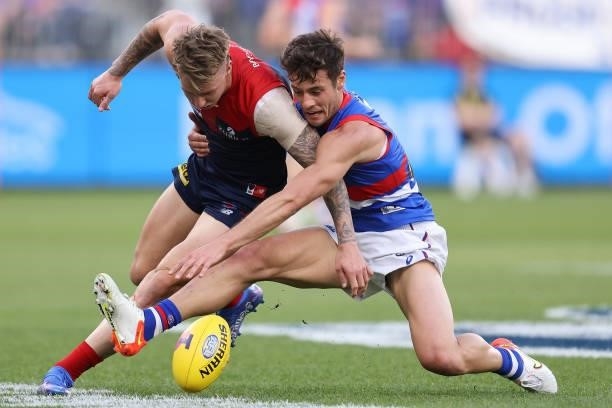 James Harmes of the Demons and Josh Dunkley of the Bulldogs contest for the ball during the 2021 AFL Grand Final match between the Melbourne Demons...