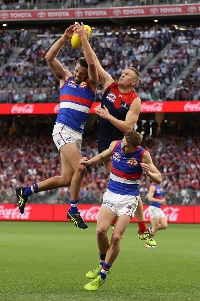 Zaine Cordy of the Bulldogs and Tom McDonald of the Demons contest for a mark during the 2021 AFL Grand Final match between the Melbourne Demons and...