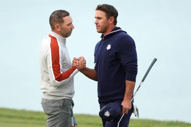Sergio Garcia of Spain and team Europe and Bryson DeChambeau of team United States shake hands on the 17th green during Saturday Afternoon Fourball...
