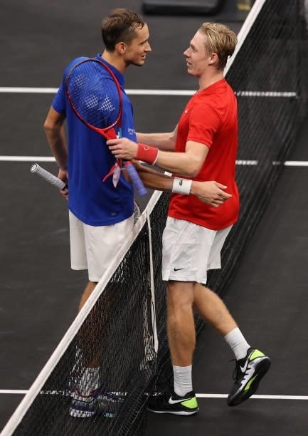 Denis Shapovalov of Team World shakes hands with Daniil Medvedev of Team Europe after the seventh match during Day 2 of the 2021 Laver Cup at TD...