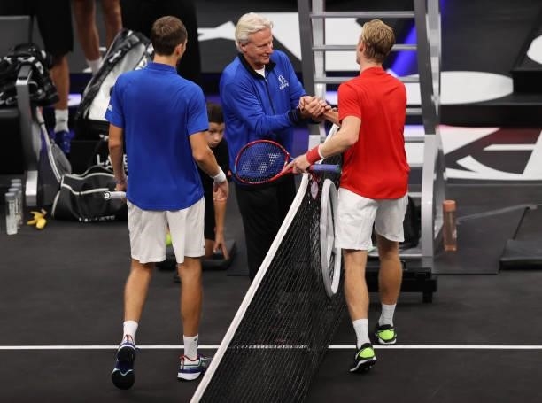 Denis Shapovalov of Team World shakes hands with Daniil Medvedev of Team Europe and Team Europe Captain Björn Borg after the seventh match during Day...
