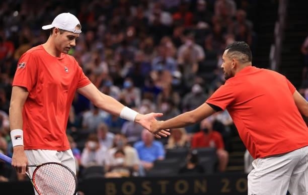 John Isner and Nick Kyrgios of Team World react against Andrey Rublev and Stefanos Tsitsipas of Team Europe during the eighth matc during Day 2 of...