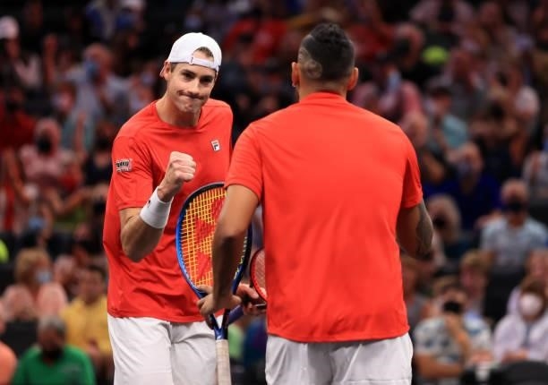 John Isner of Team World reacts with Nick Kyrgios of Team World during their match against Andrey Rublev and Stefanos Tsitsipas of Team Europe during...