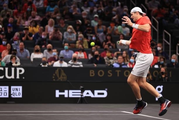 John Isner of Team World plays a shot against Andrey Rublev and Stefanos Tsitsipas of Team Europe during the eighth match during Day 2 of the 2021...