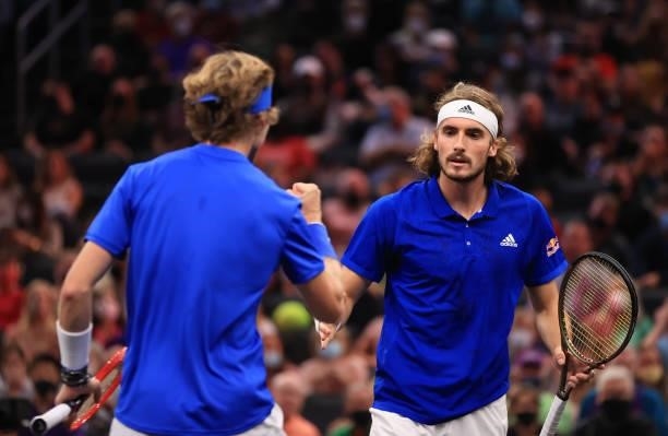 Andrey Rublev and Stefanos Tsitsipas of Team Europe react to a shot against John Isner and Nick Kyrgios of Team World during the eighth match during...