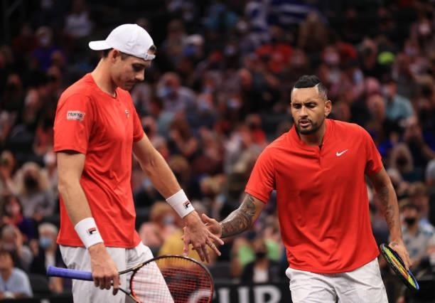 John Isner and Nick Kyrgios of Team World react to a shot against Andrey Rublev and Stefanos Tsitsipas of Team Europe during the eighth match during...