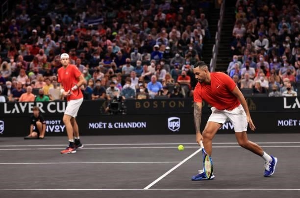 John Isner and Nick Kyrgios of Team World play a shot against Andrey Rublev and Stefanos Tsitsipas of Team Europe during the eighth match during Day...