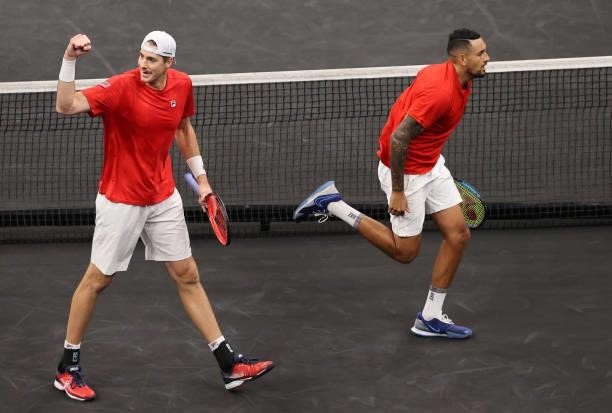 John Isner and Nick Kyrgios of Team World react to a shot against Andrey Rublev and Stefanos Tsitsipas of Team Europe during the eighth match during...