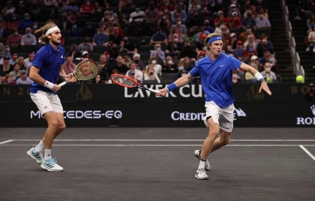 Andrey Rublev and Stefanos Tsitsipas of Team Europe play a shot against John Isner and Nick Kyrgios of Team World during the eighth match during Day...