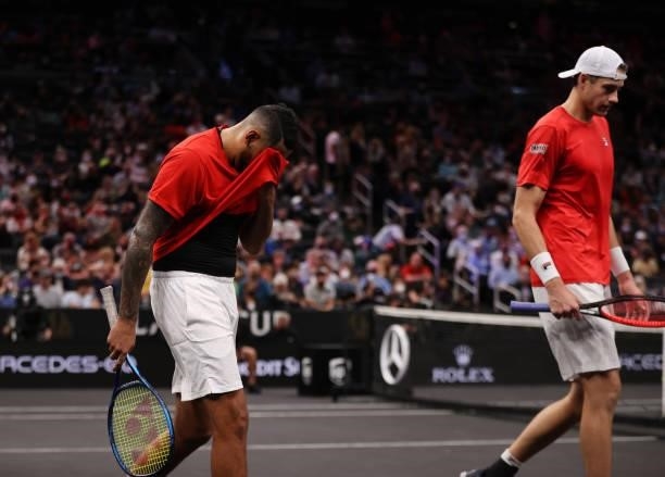 John Isner and Nick Kyrgios of Team World react after their loss to Andrey Rublev and Stefanos Tsitsipas of Team Europe during the eighth match...