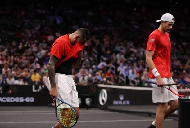 John Isner and Nick Kyrgios of Team World react after their loss to Andrey Rublev and Stefanos Tsitsipas of Team Europe during the eighth match...