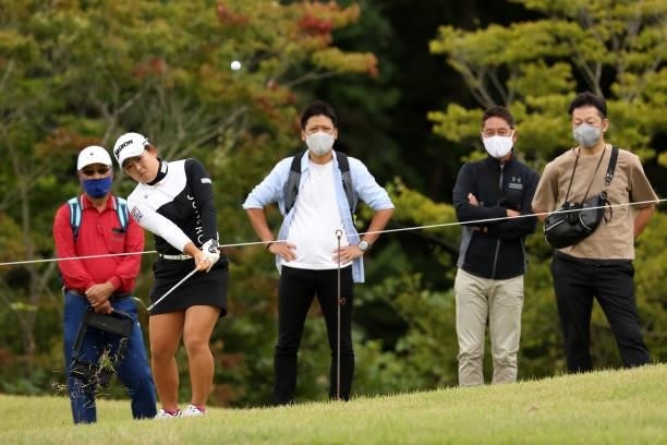 Saki Asai of Japan chips onto the 8th green during the final round of the Miyagi TV Cup Dunlop Ladies Open at Rifu Golf Club on September 26, 2021 in...
