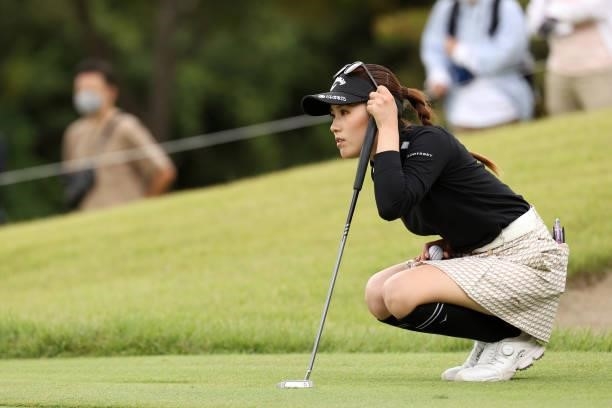 Yuna Nishimura of Japan lines up a putt on the 8th green during the final round of the Miyagi TV Cup Dunlop Ladies Open at Rifu Golf Club on...