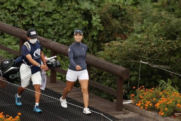Momoko Ueda of Japan walks the bridge during the final round of the Miyagi TV Cup Dunlop Ladies Open at Rifu Golf Club on September 26, 2021 in Rifu,...