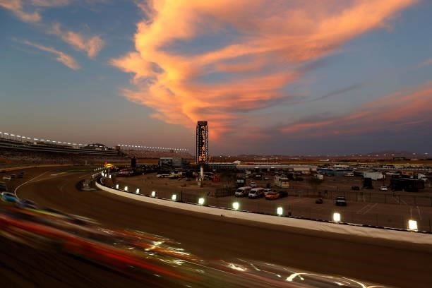 General view of racing as the sun sets during the NASCAR Xfinity Series Alsco Uniforms 302 at Las Vegas Motor Speedway on September 25, 2021 in Las...