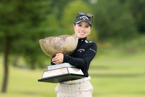 Yuna Nishimura of Japan poses with the trophy after winning the tournament following the final round of the Miyagi TV Cup Dunlop Ladies Open at Rifu...