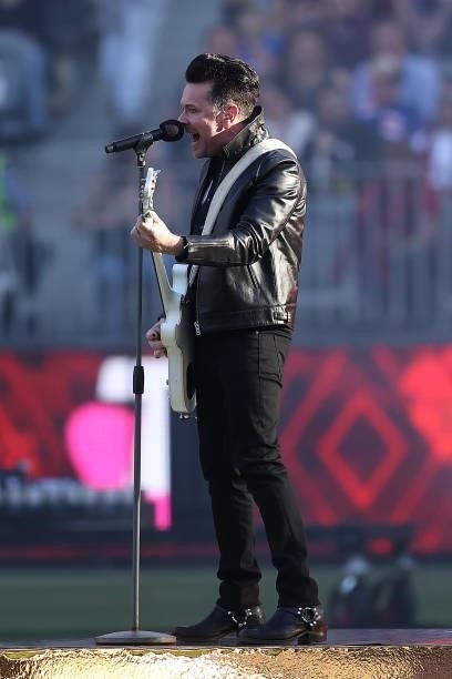 Kavyen Temperley of Eskimo Joe performs during the 2021 AFL Grand Final match between the Melbourne Demons and the Western Bulldogs at Optus Stadium...