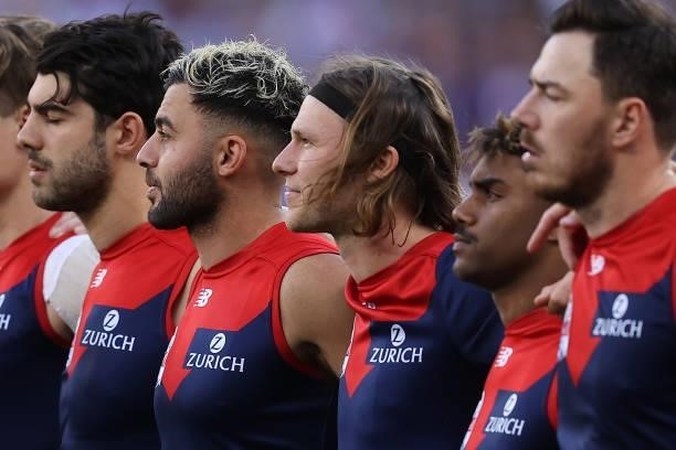 Christian Salem and Ed Langdon of the Demons look on as the teams line up during the 2021 AFL Grand Final match between the Melbourne Demons and the...