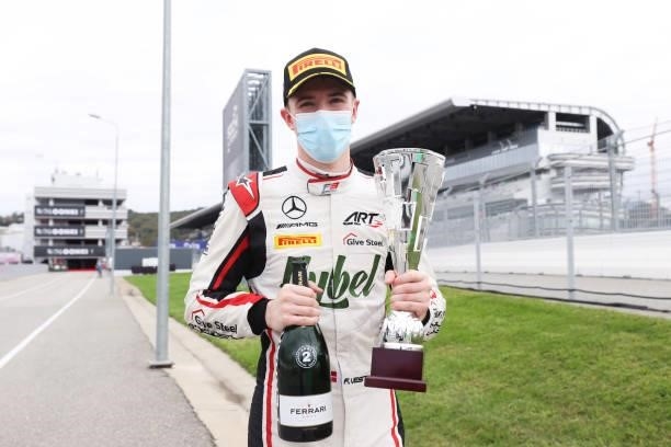 Second placed Frederik Vesti of Denmark and ART Grand Prix celebrates with his trophy after race 3 of Round 7:Sochi of the Formula 3 Championship at...