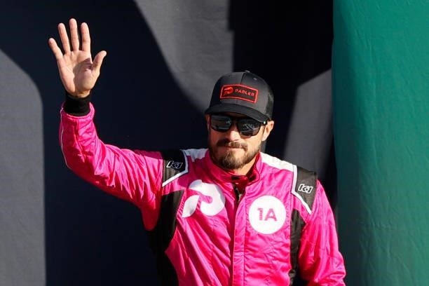 Yeley, driver of the Parler Chevrolet, waves to fans during pre-race ceremonies prior to the NASCAR Xfinity Series Alsco Uniforms 302 at Las Vegas...