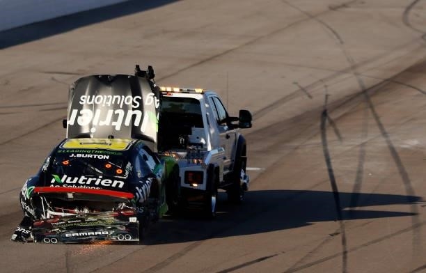 The Nutrien Ag Solutions Chevrolet, driven by Jeb Burton is towed after an on-track incident during the NASCAR Xfinity Series Alsco Uniforms 302 at...
