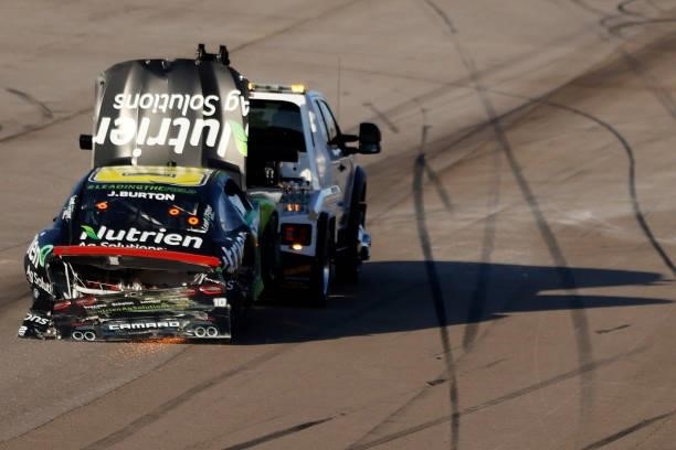 The Nutrien Ag Solutions Chevrolet, driven by Jeb Burton is towed after an on-track incident during the NASCAR Xfinity Series Alsco Uniforms 302 at...