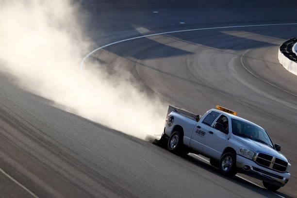 The track crew cleans the driving surface after an incident during the NASCAR Xfinity Series Alsco Uniforms 302 at Las Vegas Motor Speedway on...