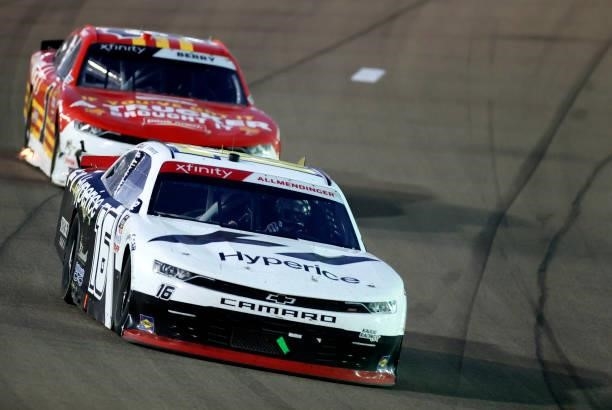 Allmendinger, driver of the Hyperice Chevrolet, and Josh Berry, driver of the PFJ Thank A Trucker Chevrolet, race during the NASCAR Xfinity Series...