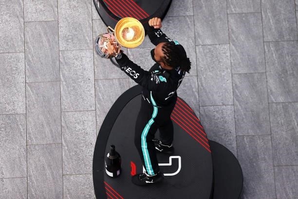 Race winner Lewis Hamilton of Great Britain and Mercedes GP celebrates on the podium during the F1 Grand Prix of Russia at Sochi Autodrom on...