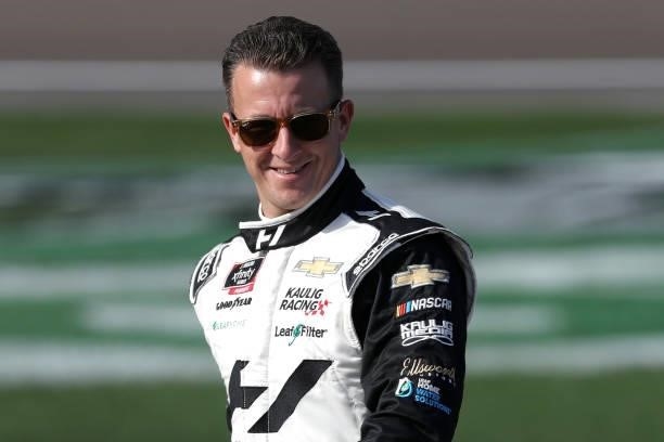 Allmendinger, driver of the Hyperice Chevrolet, walks the grid prior to the NASCAR Xfinity Series Alsco Uniforms 302 at Las Vegas Motor Speedway on...