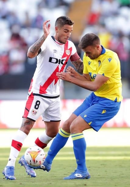 Oscar Trejo of Rayo Vallecano battles for possession with Cala of Cadiz during the LaLiga Santander match between Rayo Vallecano and Cadiz CF at...