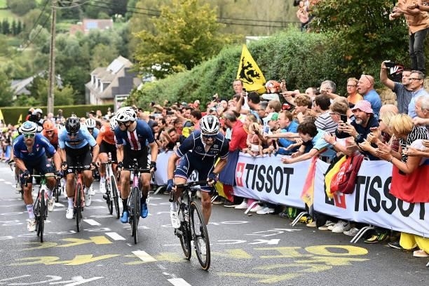 Sonny Colbrelli of Italy, Wout Van Aert of Belgium, Neilson Powless of The United States and Julian Alaphilippe of France compete while fans cheer...