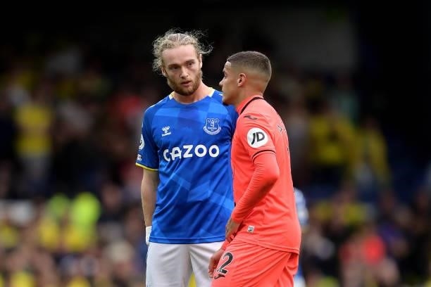 Tom Davies of Everton speaks to Max Aarons after the Premier League match between Everton and Norwich City at Goodison Park on September 25, 2021 in...
