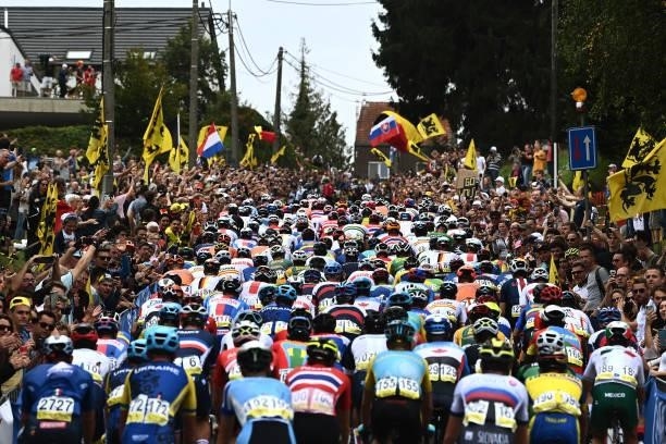 General view of the Peloton passing through Moskesstraat hill while fans cheer during the 94th UCI Road World Championships 2021 - Men Elite Road...