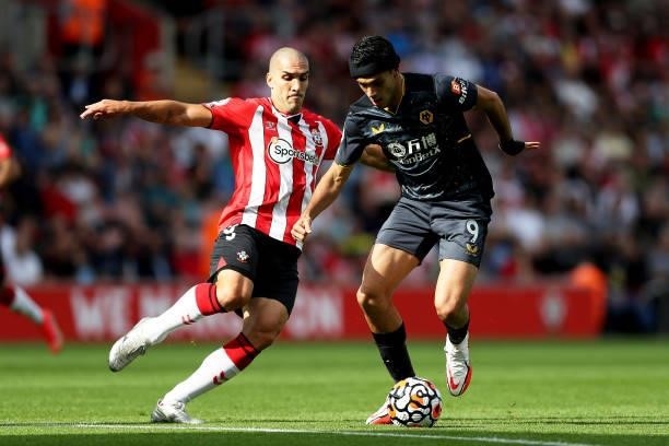 Raul Jimenez of Wolverhampton Wanderers is challenged by Oriol Romeu of Southampton during the Premier League match between Southampton and...